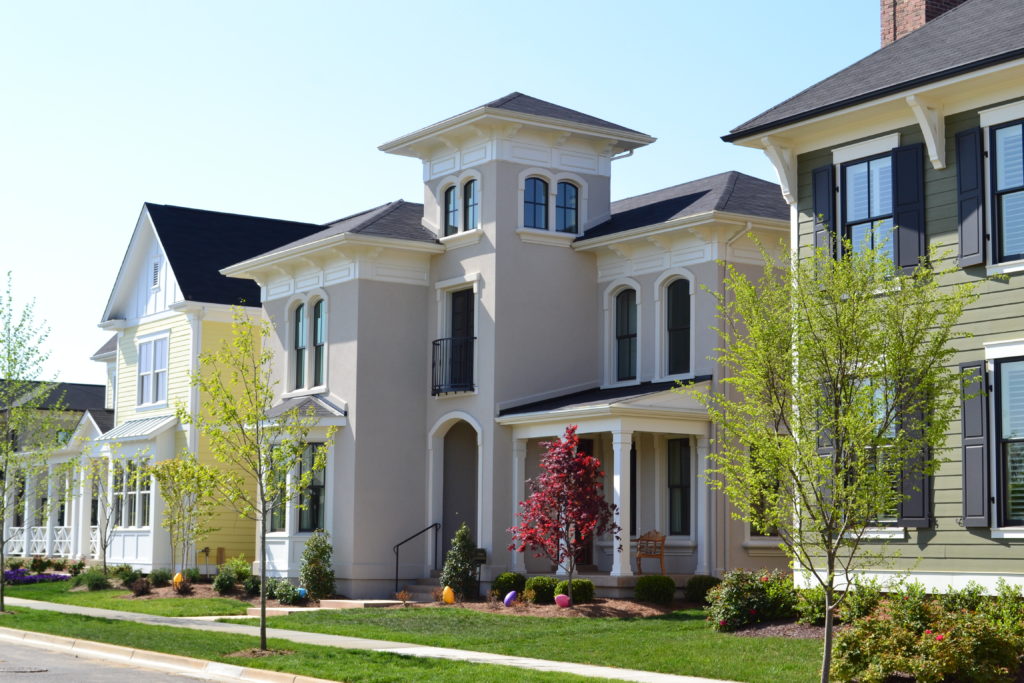 Image of townhomes from a road perspective.